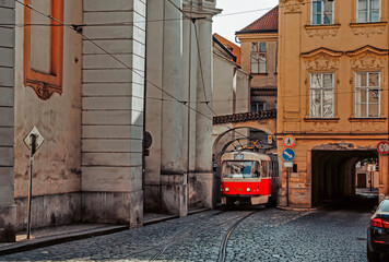 Vintage tram tramway between buildings in the streets of Prague city