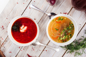 Wall Mural - Top view on two soups borsch and vegetable
