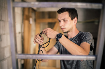 Wall Mural - Behind the scene. Sound engineer is connecting the audio cables in the theater