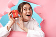 © Drobot Dean - Caucasian young attractive woman smiling and holding present box