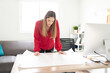 © AntonioDiaz - Examining blueprints for a construction project