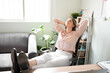 © AntonioDiaz - Woman relaxing in her office