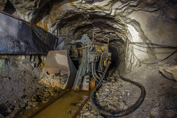 Wall Mural - Loading machine EIMCO rocker shovel loader in underground gold mine