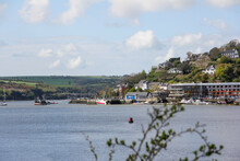 Port Of Kinsale With Vegetation And Background Huts With Blurred Plants In The Foreground