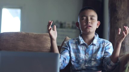 Wall Mural - Boy raise up hands praying in front computer laptop, Online church in home, Home church during quarantine coronavirus Covid-19, Religion concept.