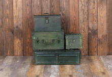 Green Military Boxes On A Wooden Background