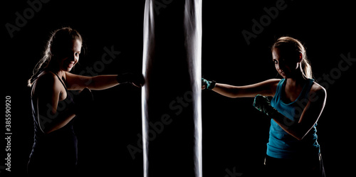 Ταπετσαρία τοιχογραφία two kick fighter girls punching a boxing bag