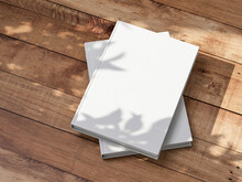 Two White Books Mockup With Textured Hardcover On Wooden Table Outdoors