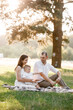 © Andriy Medvediuk - father, mother and son blow soap bubbles in the park together on a sunny summer day. happy family having fun outdoor