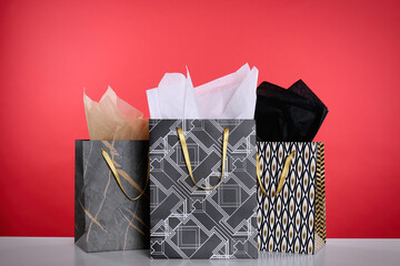 Shopping bags with paper on red background