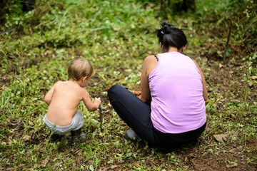 mom and son planting together