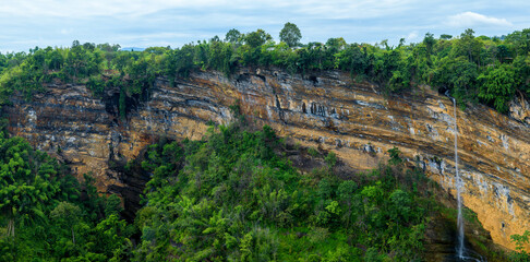 Wall Mural - panoramic beautiful waterfall and mountains in deep forest at thailand.