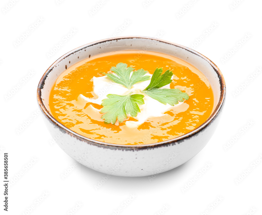 Tasty pumpkin cream soup in bowl on white background