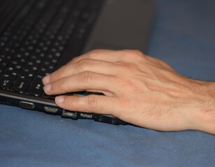 person typing on a laptop