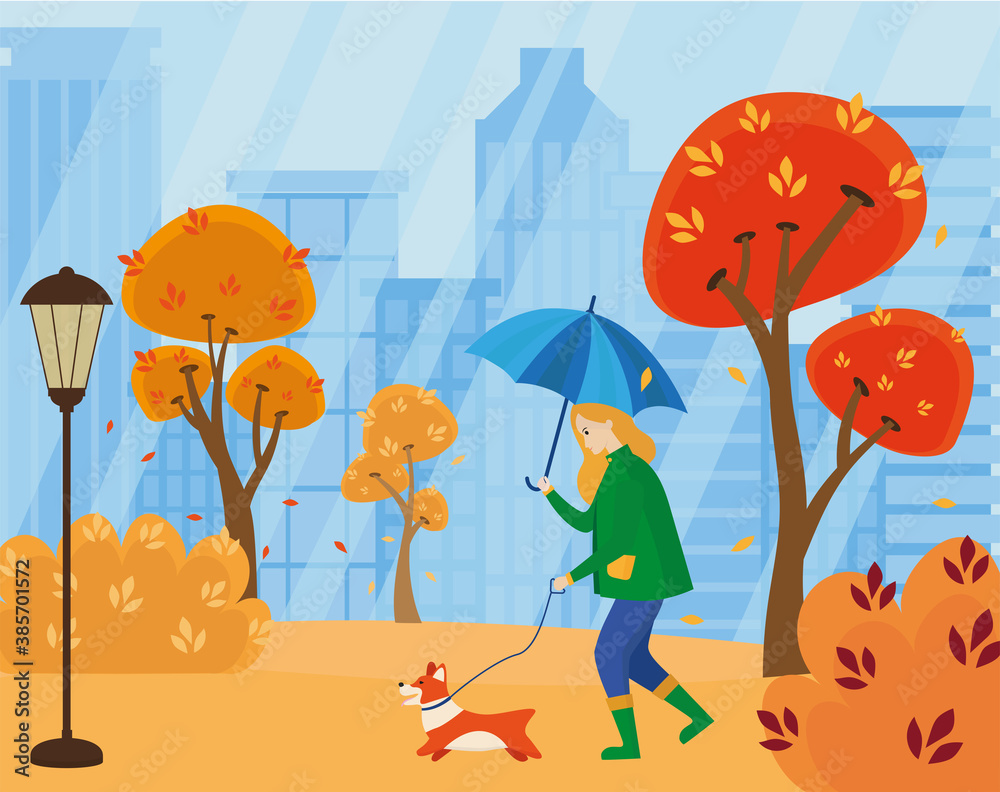 A girl with an umbrella in the rain walks with a dog in an autumn city ...