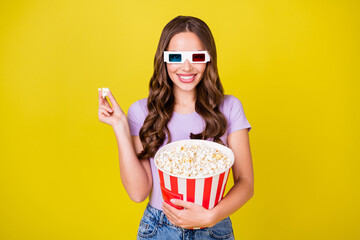 Sticker - Portrait of gorgeous cheerful wavy-haired girl eating corn watching film free time isolated on bright yellow color background