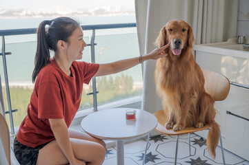 Canvas Print - Golden Retriever and woman sitting on chairs