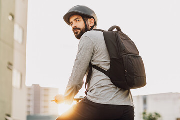 Young adult riding a bicycle through the city