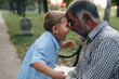 © cherryandbees - boy with his grandfather in park