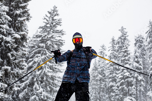 Cuadros en Lienzo Man skiing on slopes in the french alps, snowing.