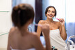© F8  \ Suport Ukraine - Portrait of beautiful young woman brushing teeth in bathroom