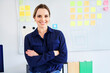 © Bartek Szewczyk/Westend61 - Confident businesswoman standing with arms crossed in creative office