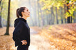 © Bartek Szewczyk/Westend61 - Young woman during break in autumn forest