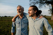 © KNSY/Westend61 - Father and adult son embracing on a meadow in the countryside