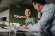 © Mareen Fischinger/Westend61 - Father helping son with his homework