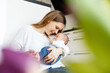 © Sandro J√∂dicke |¬†whitedesk/Westend61 - Mother holding sleeping baby boy in arms at home