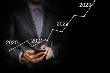 Aufkleber - Man's hand pointing graph of success in 2022 year. Growing business concept