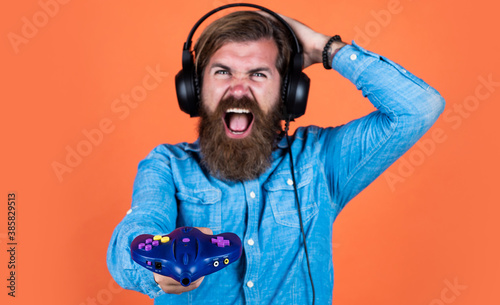 oh no. concept of tv gaming. man in headphones with console. hobby. just have fun. new technology in modern life. happy gamer play computer games. man playing video games. online game