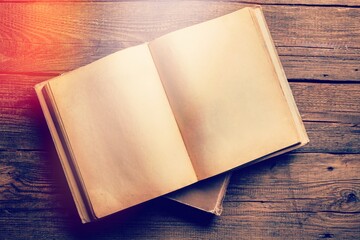 Wall Mural - vintage open book on old wooden table