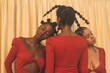 © Christopher Michael - Two Black models with eyes closed heads resting on shoulder of third model