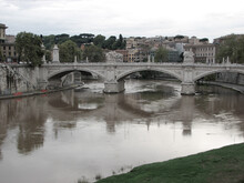 Rome, Italy - September 26 2006 - Ponte Vittorio Emanuel II, A Bridge Over The Tiber River On A Cloudy, Overcast Day. It Was Designed By Ponte Vittorio Emanuel II.  Image Has Copy Space.