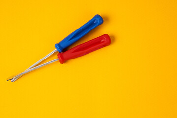 screwdrivers and construction tools on yellow background equipment for repair industry