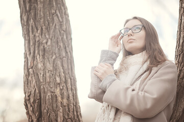 Wall Mural - autumn girl glasses / autumn look girl in transparent glasses, eyesight