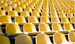 Leinwandbild Motiv yellow tribunes. seats of tribune on sport stadium. empty outdoor arena. concept of fans. chairs for audience. cultural environment concept. color and symmetry. empty seats. modern stadium