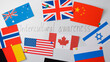 © Vitalii - Flags of many different countries hanging on the white wall. Concept of intercultural awareness.
