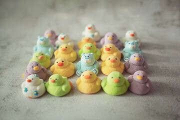 
marshmallows in the form of ducks of different colors