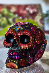 Wall Mural - Mexican day of the dead skull with multicolored daisies and purple teeth