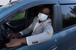 © vilma3000 - African American in protective mask in car