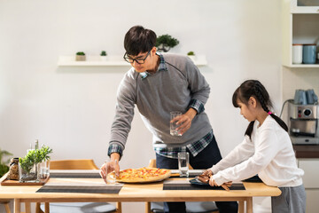 Daughter help dad prepare dining table