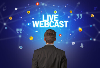 rear view of a businessman with live webcast inscription, social networking concept