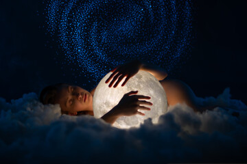 Wall Mural - tender naked beautiful woman lies on the soft clouds and hugs the bright moon. amazing starry sky ba