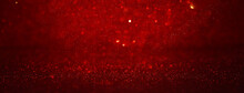 Background Of Abstract Red, Gold And Black Glitter Lights. Defocused