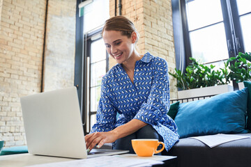 Aufkleber - Woman checking email on laptop