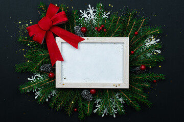 Wall Mural - christmas frame mockup for greeting cards on a black background.