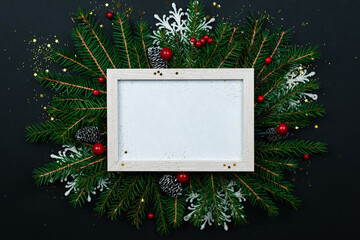 Wall Mural - christmas frame mockup for greeting cards on a black background.