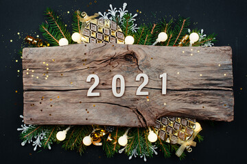 Wall Mural - symbol from number 2021 on wooden background. happy new year 2021.